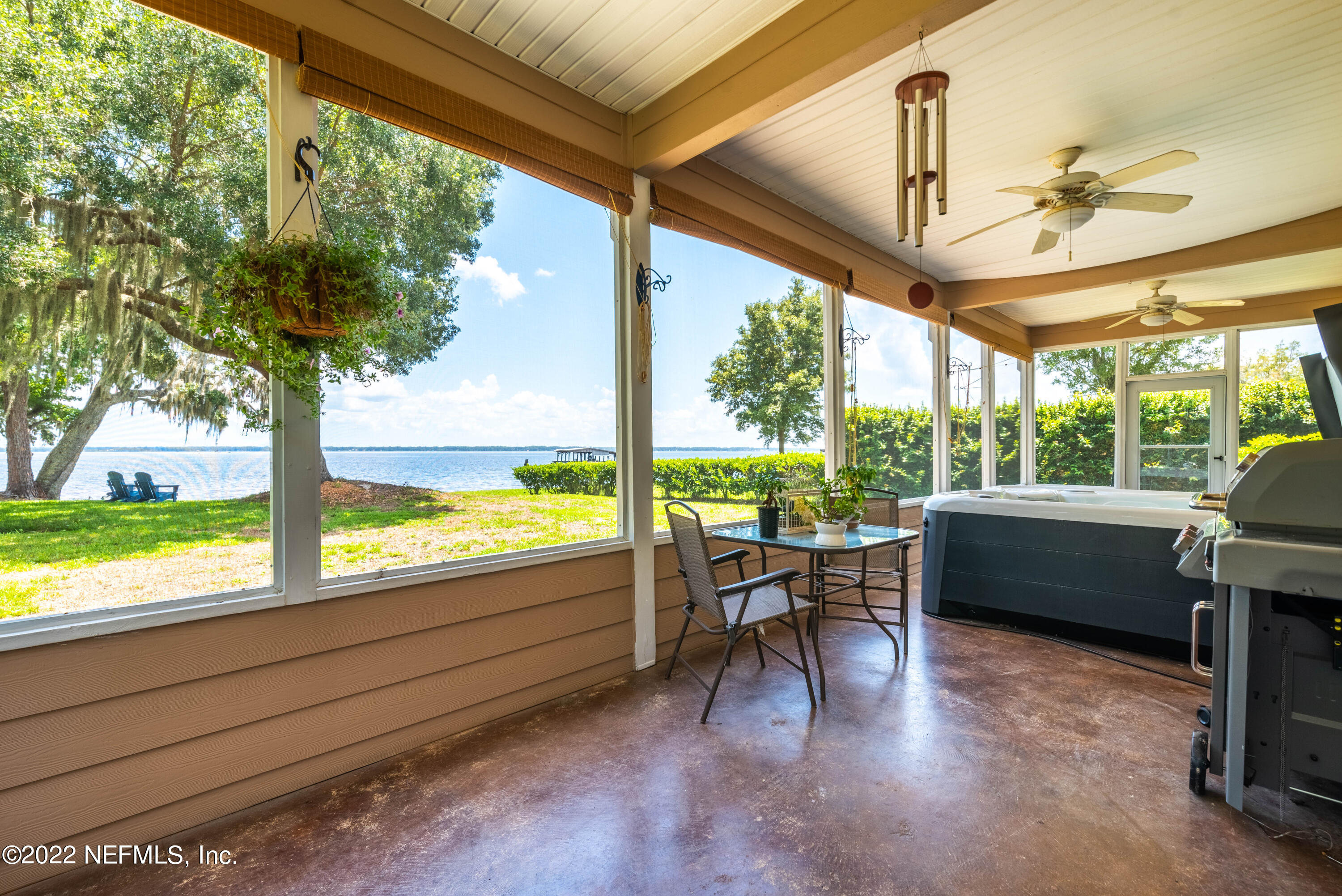 5345 Pine Avenue Fleming Island, FL 32003 - Photo 30 of 39 a view of a porch with furniture and a yard