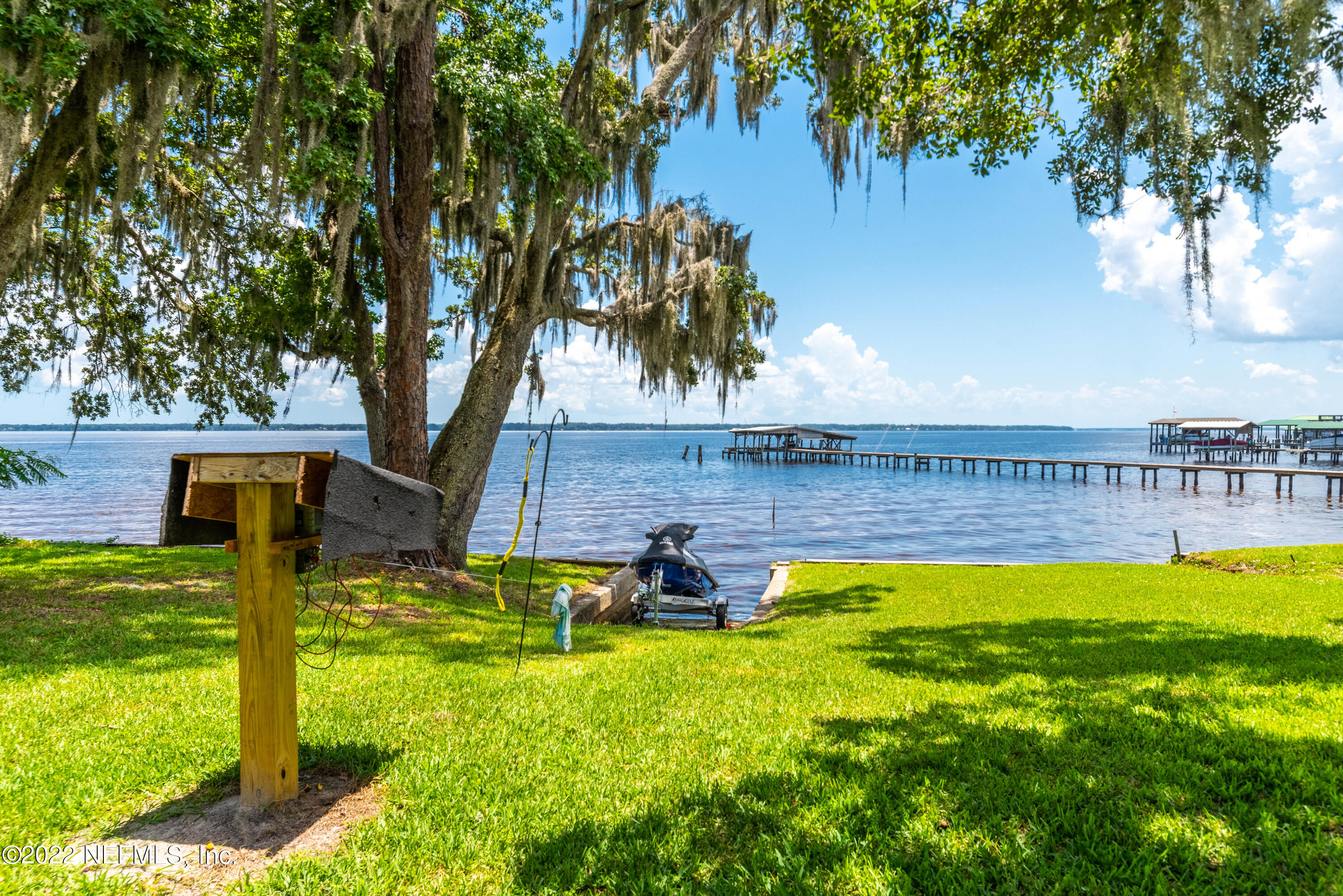 5345 Pine Avenue Fleming Island, FL 32003 - Photo 32 of 39 a swimming pool with outdoor seating and yard