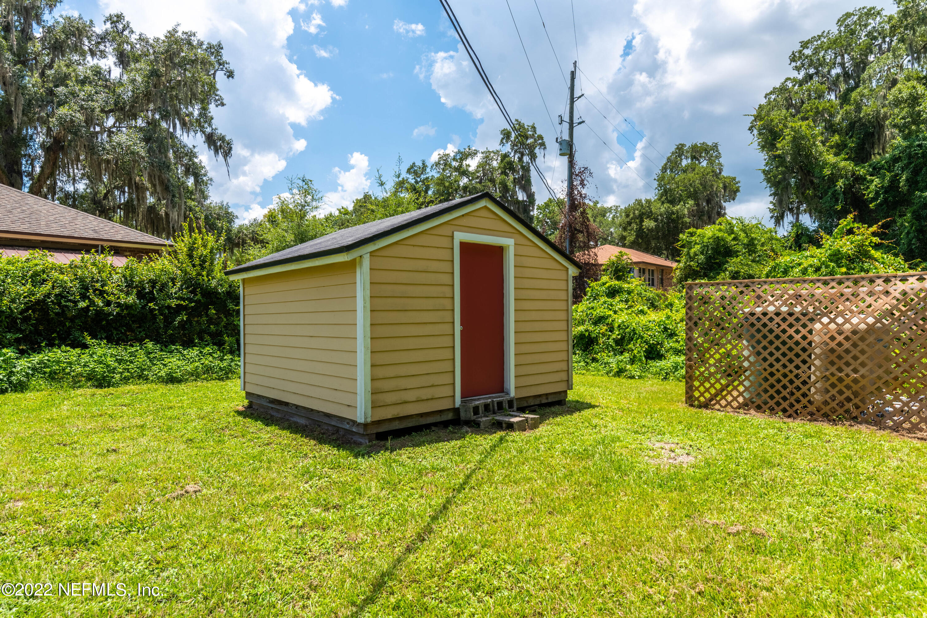 5345 Pine Avenue Fleming Island, FL 32003 - Photo 35 of 39 a view of a backyard with barn and plants