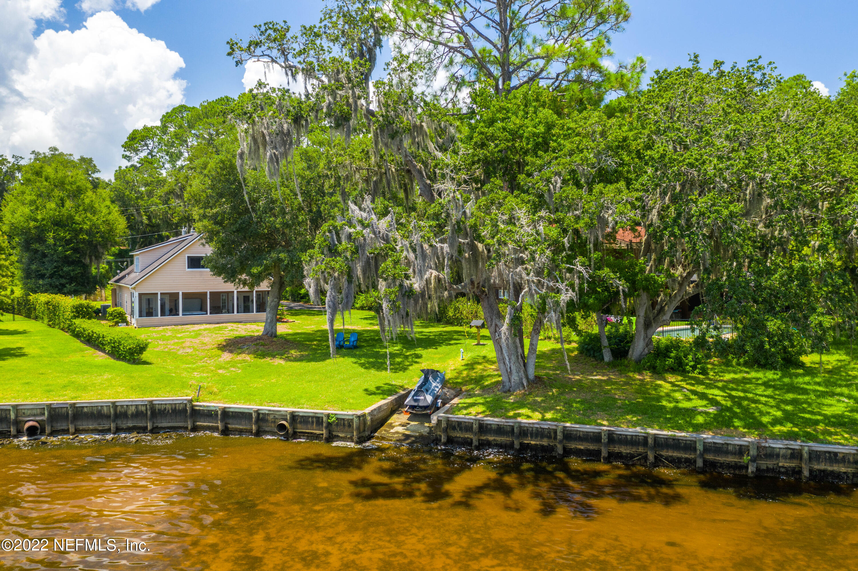 5345 Pine Avenue Fleming Island, FL 32003 - Photo 37 of 39 a view of a house with swimming pool and yard