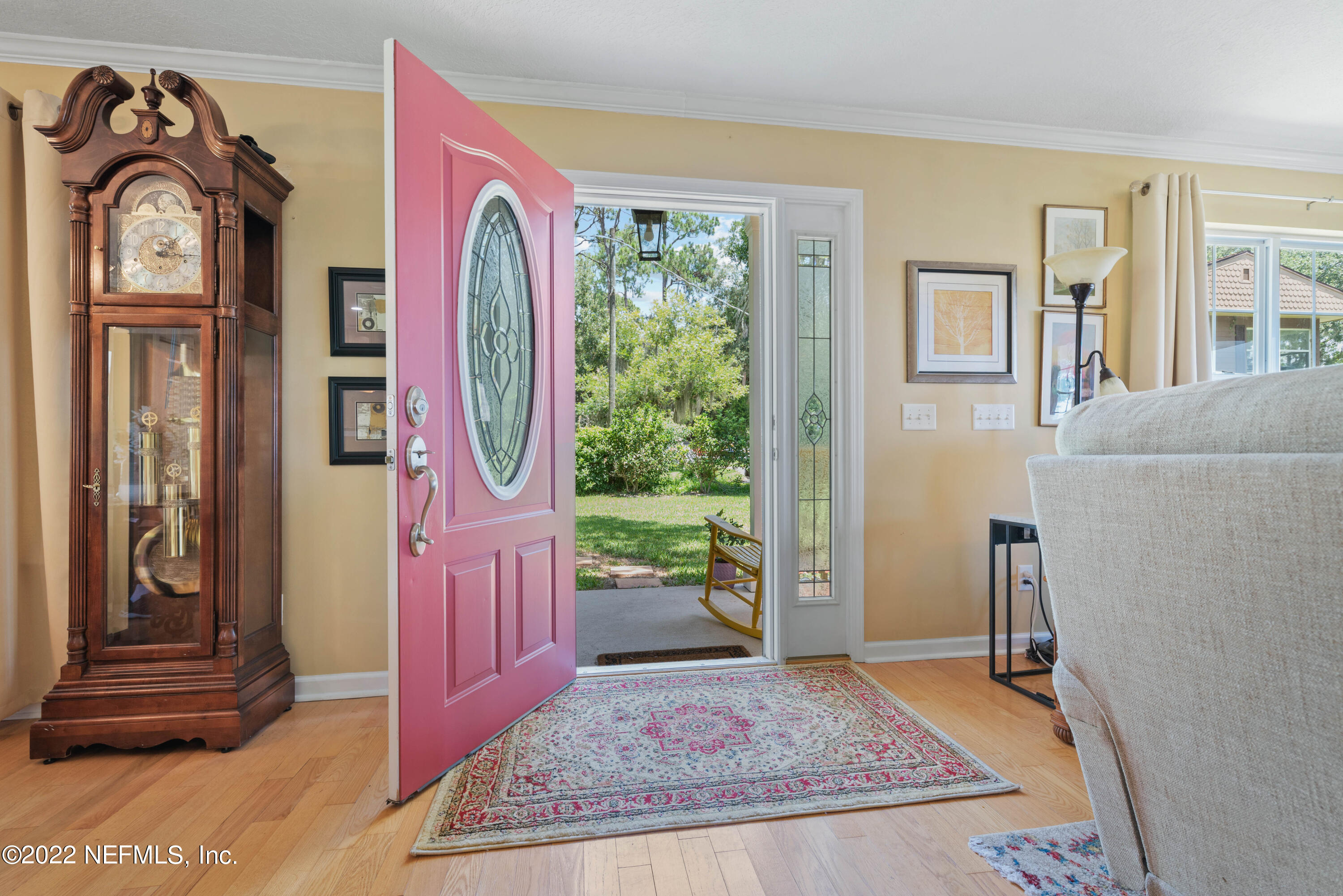 5345 Pine Avenue Fleming Island, FL 32003 - Photo 8 of 39 a view of an entryway with wooden floor and a rug