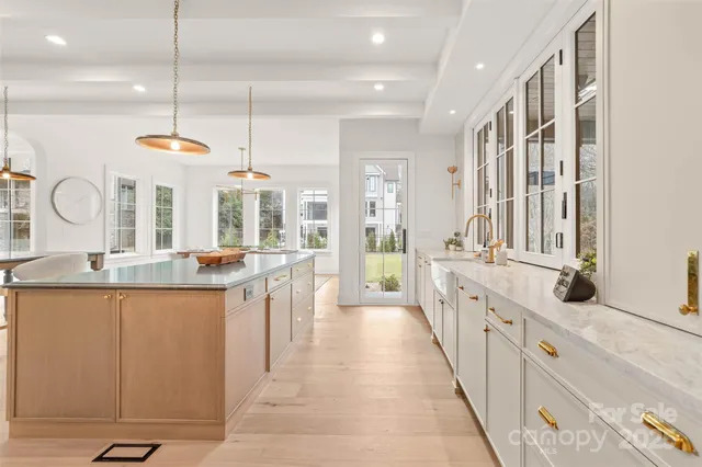a kitchen with stainless steel appliances granite countertop a stove and cabinets