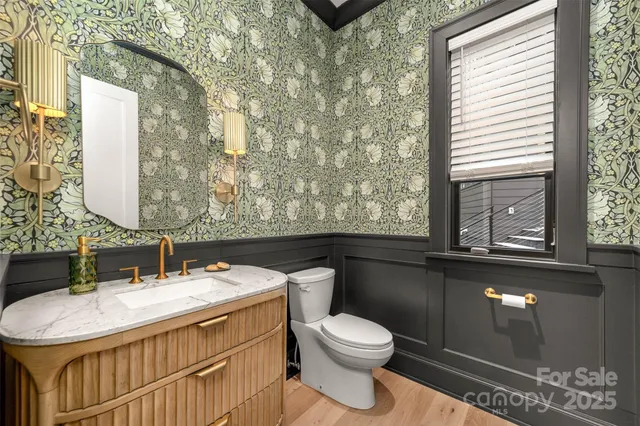 a bathroom with a black and white checkered floor