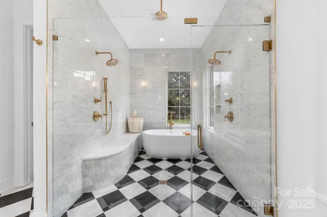 a view of a house with a small yard and plants