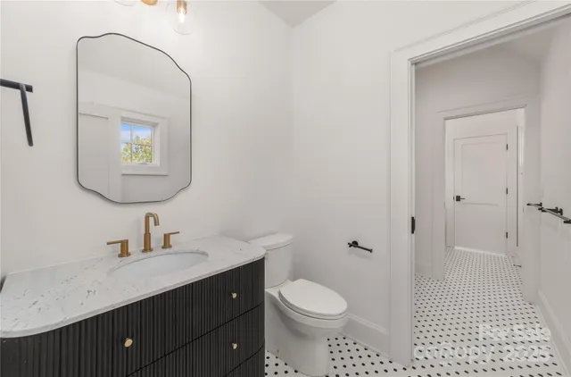 a view of a patio with table and chairs next to a yard