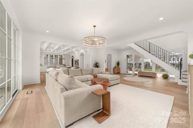 a living room with furniture a fireplace and a table