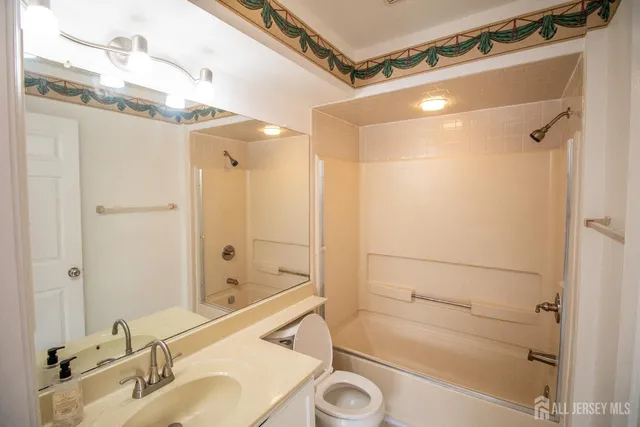 a bathroom with a shower and a sink