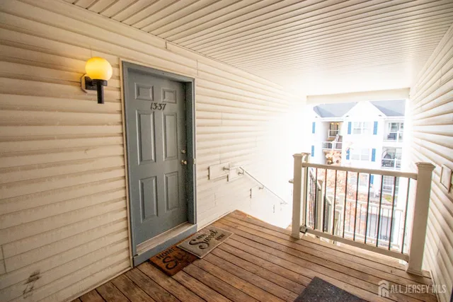 a view of a balcony with wooden floor