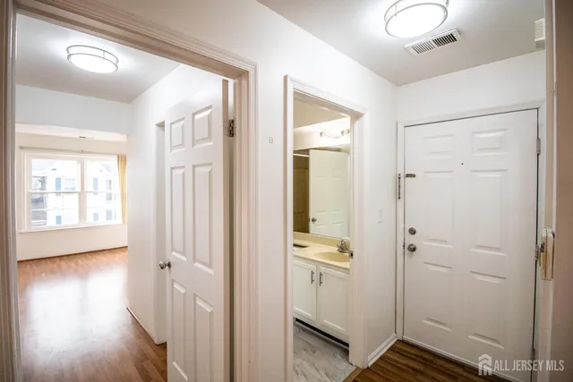 a view of a bathroom with sink and shower