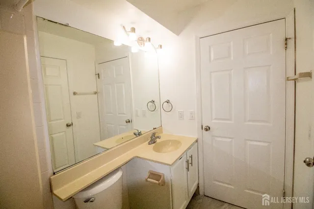 a bathroom with a sink a mirror and a shower