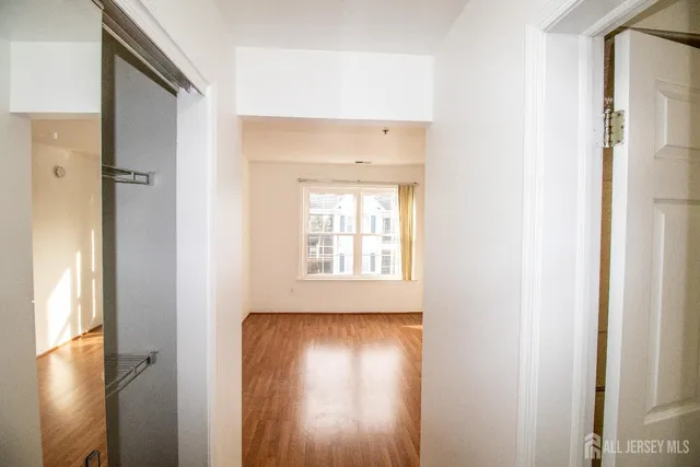 a view of front door with wooden floor