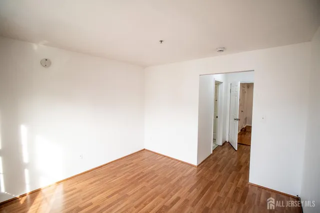 a view of hallway with wooden floor