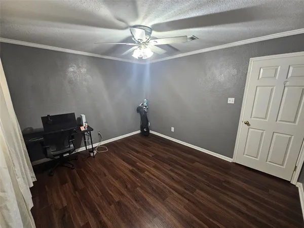 a view of a room with wooden floor