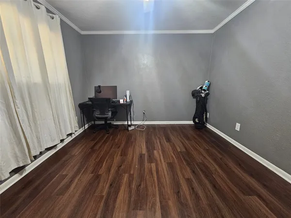 a bedroom with bed and window