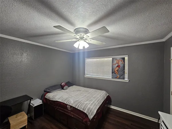 a view of a hallway with furniture and wooden floor