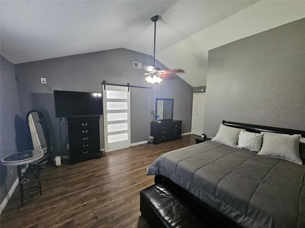 a view of a kitchen cabinets and a wooden floor