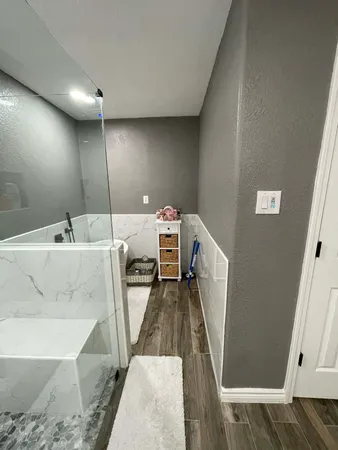 a room with stainless steel appliances a stove and a table