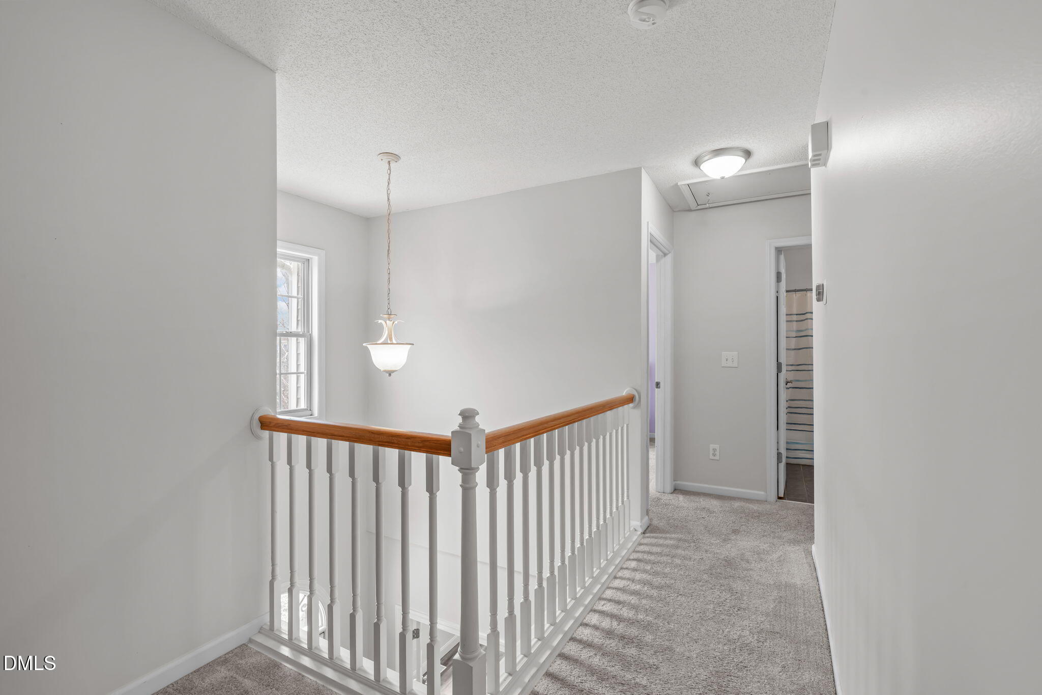 2501 Springfield Park Drive Raleigh, NC 27614 - Photo 27 of 44 a view of a hallway with a door and stairs