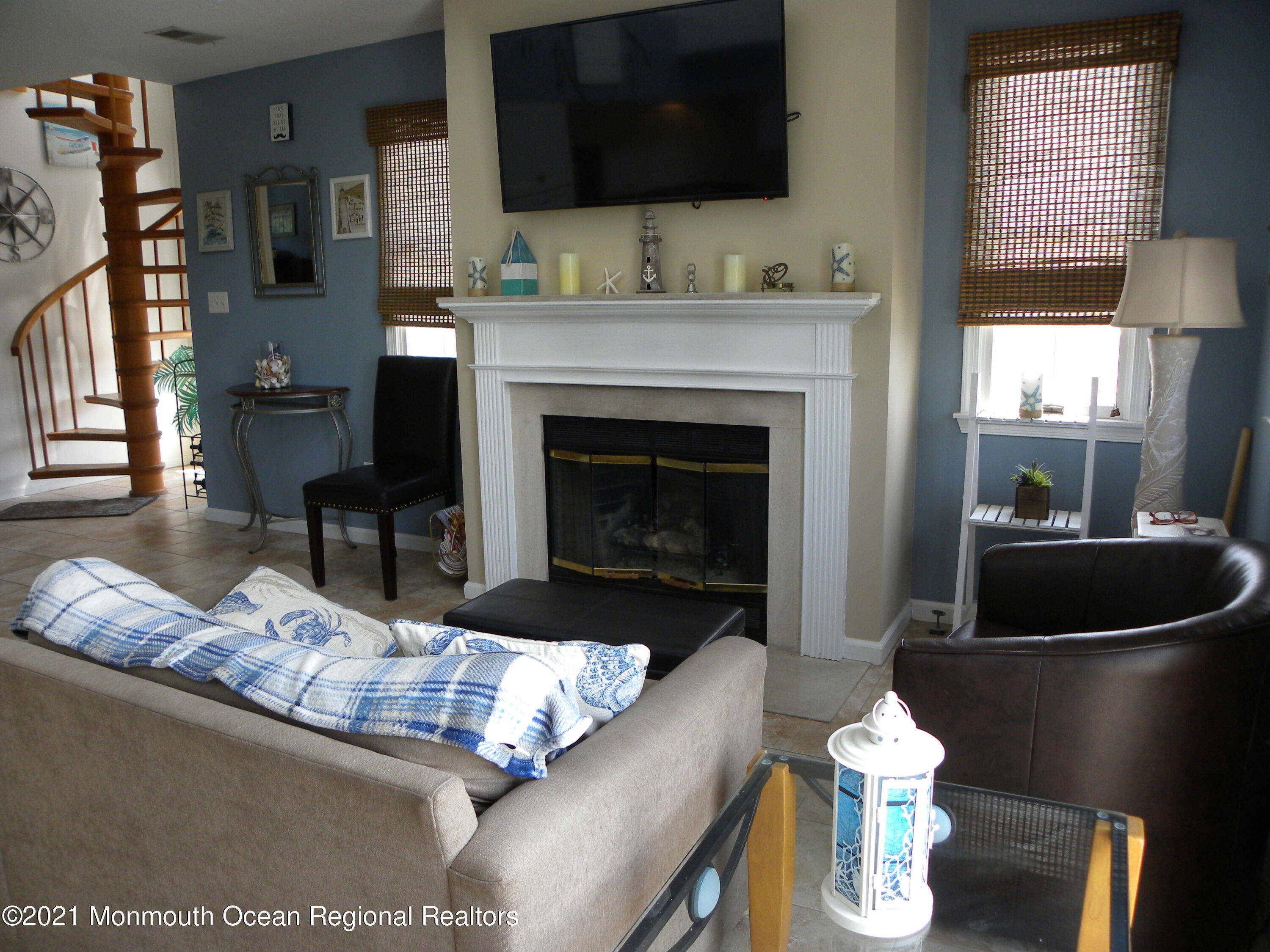337 Lacey Road, Unit 37 Forked River, NJ 08731 - Photo 2 of 34 a living room with furniture and a fireplace