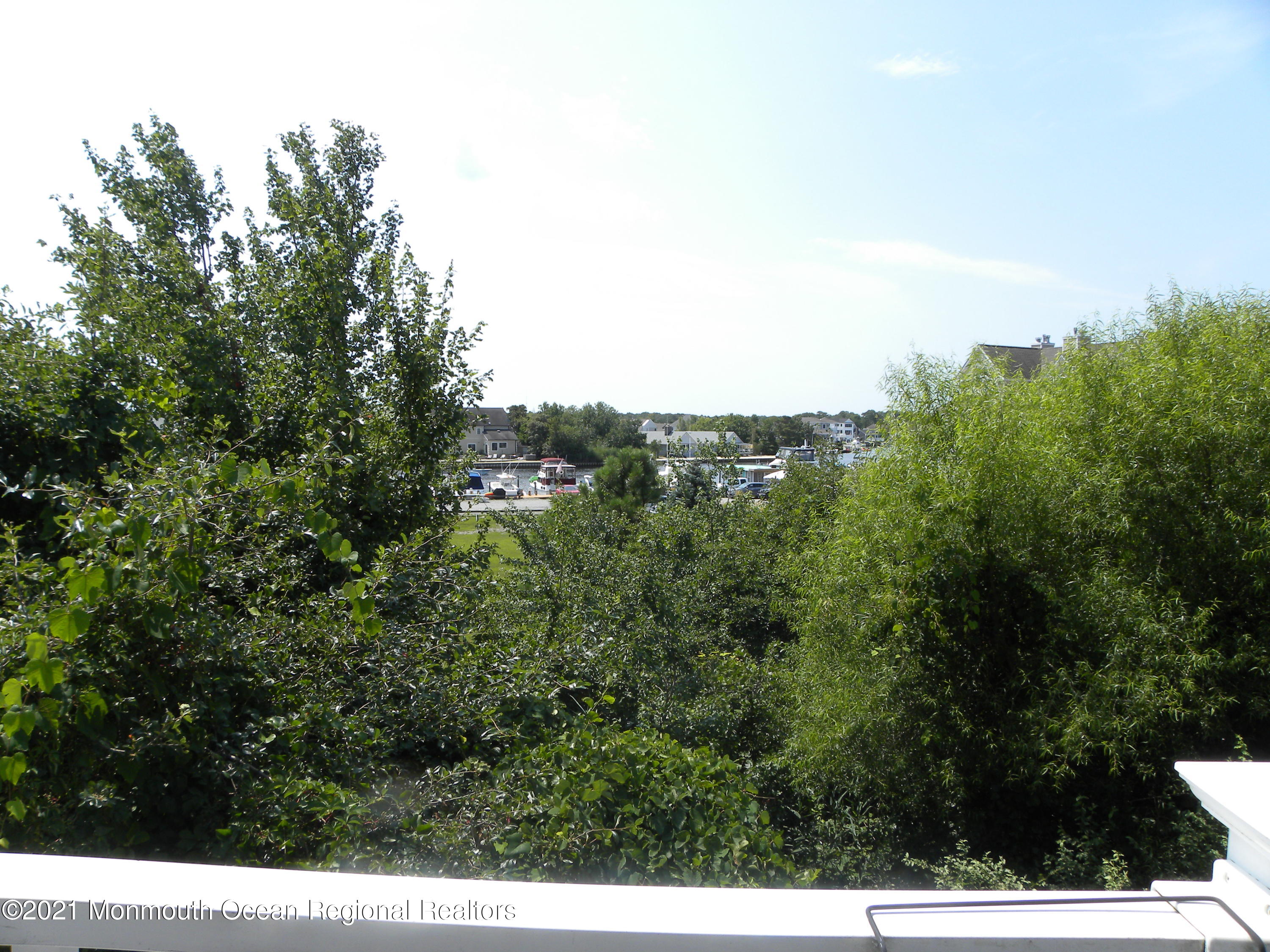 337 Lacey Road, Unit 37 Forked River, NJ 08731 - Photo 11 of 34 a view of a city with lush green forest