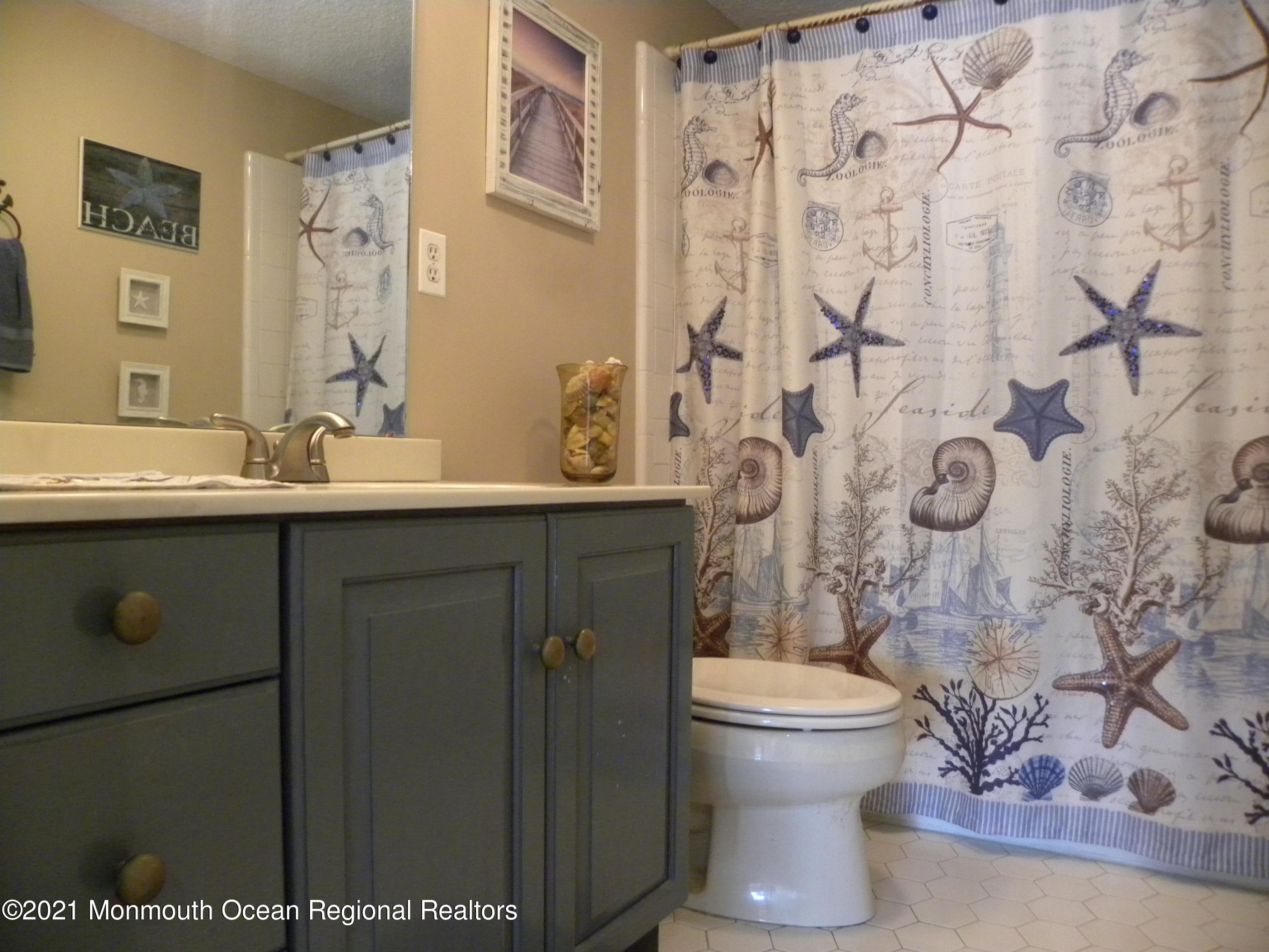 337 Lacey Road, Unit 37 Forked River, NJ 08731 - Photo 15 of 34 a bathroom with a sink toilet and shower