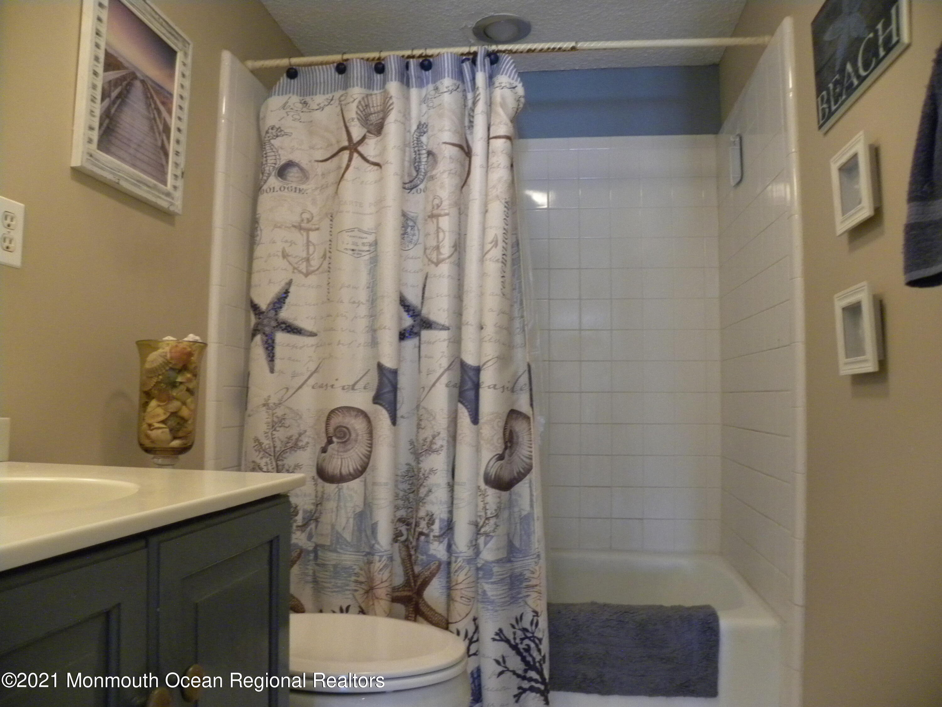 337 Lacey Road, Unit 37 Forked River, NJ 08731 - Photo 16 of 34 a bathroom with a sink a toilet and shower