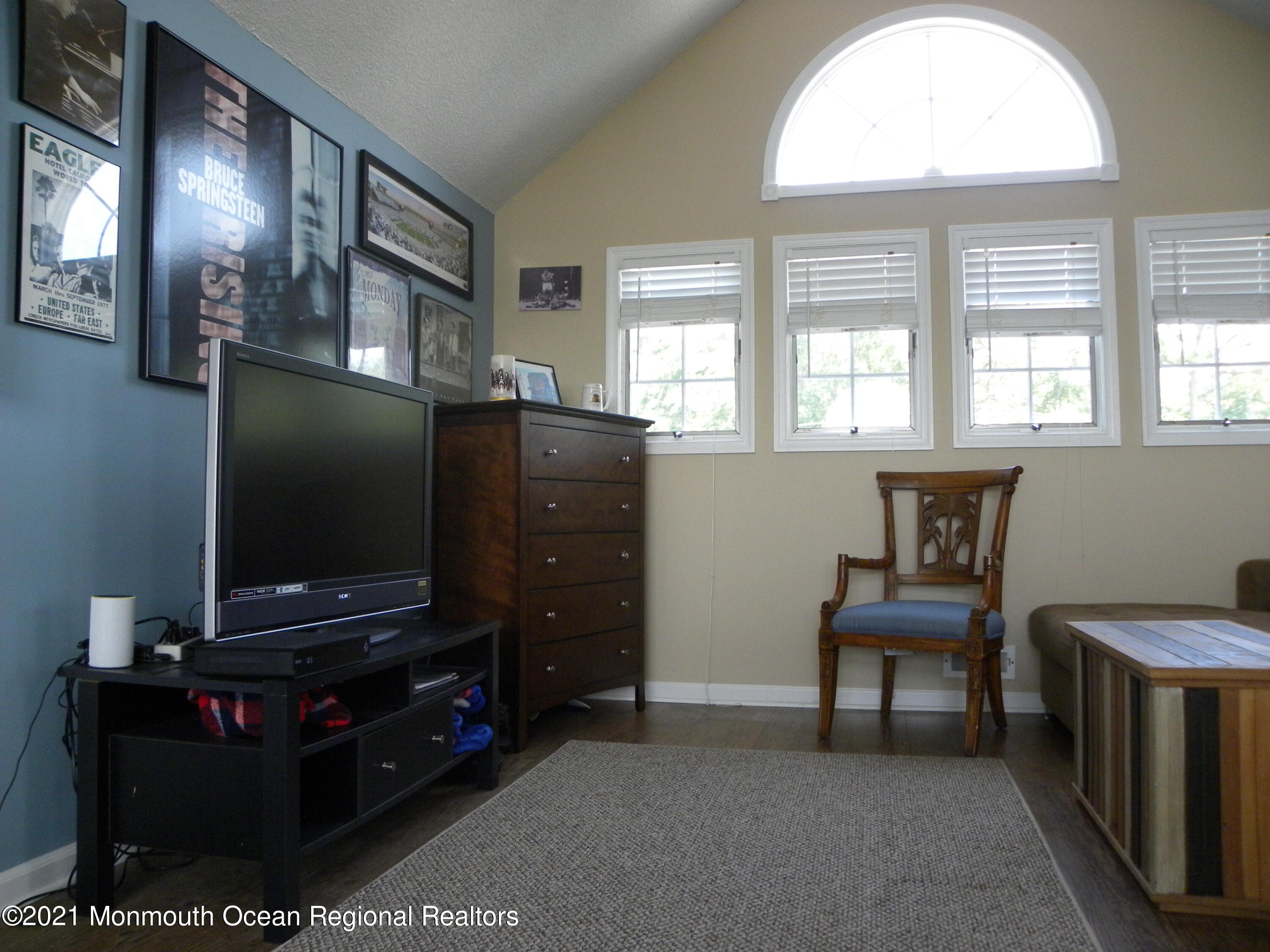 337 Lacey Road, Unit 37 Forked River, NJ 08731 - Photo 20 of 34 a living room with furniture and a flat screen tv