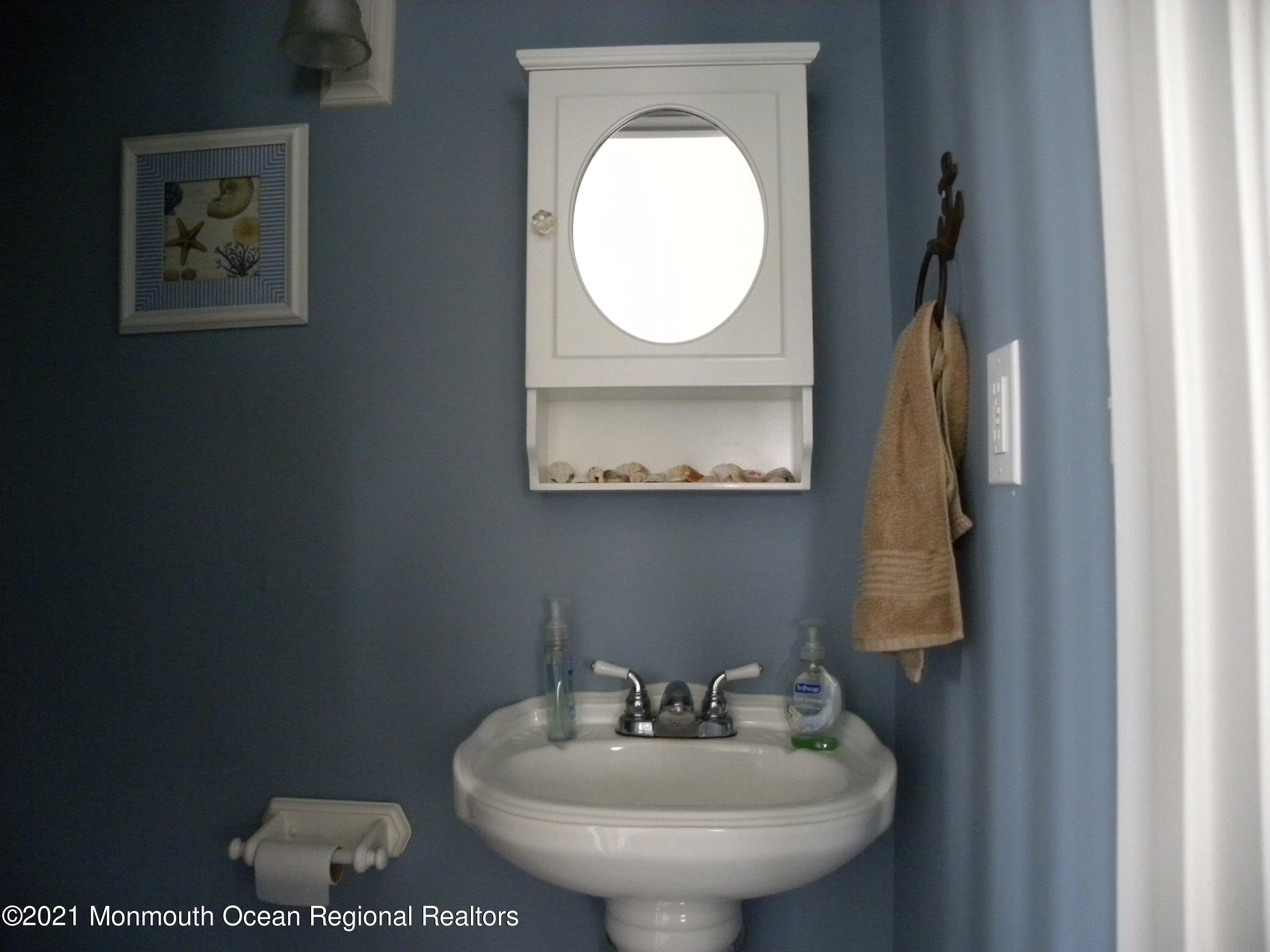 337 Lacey Road, Unit 37 Forked River, NJ 08731 - Photo 26 of 34 a bathroom with a toilet sink and mirror
