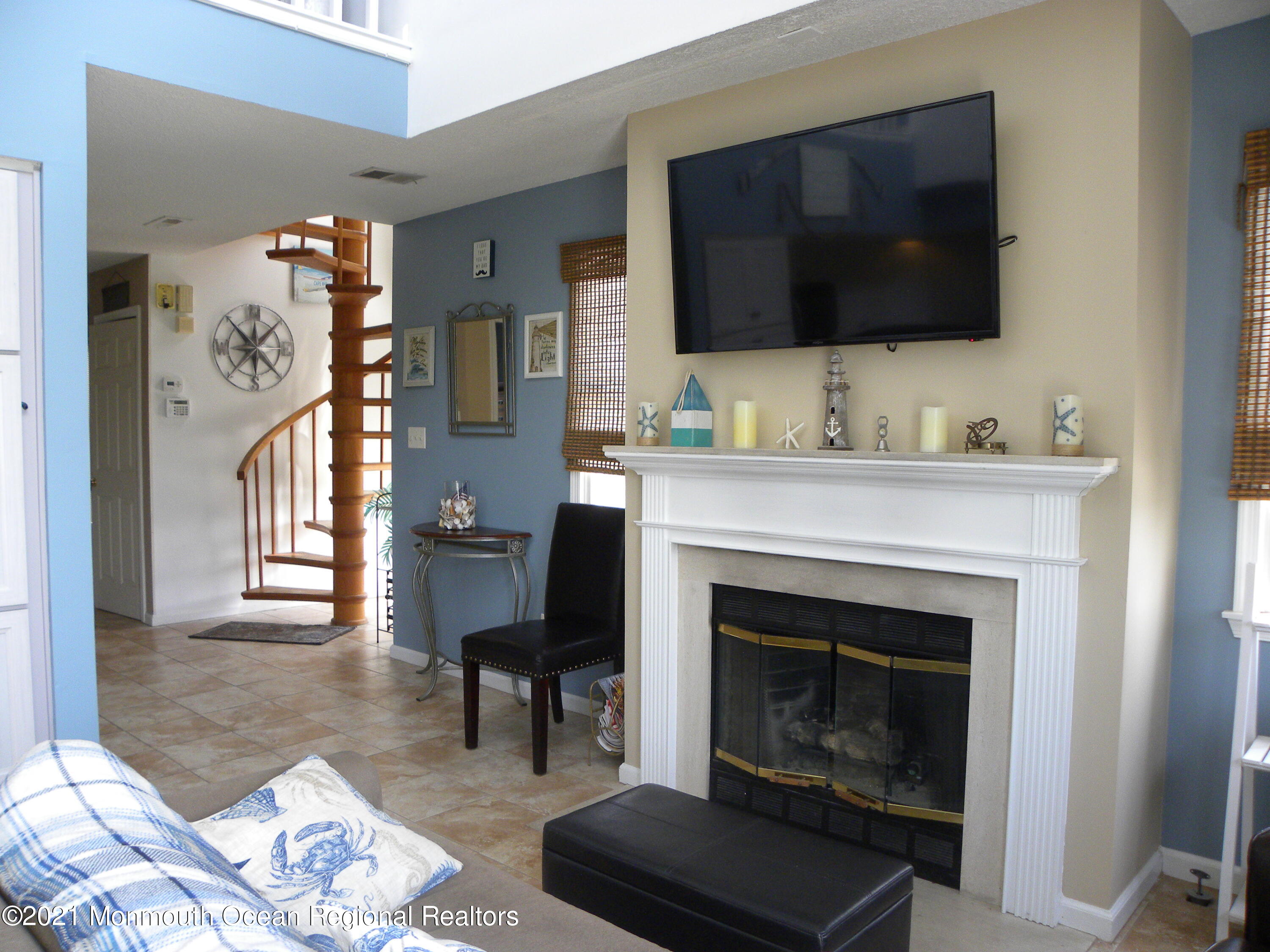 337 Lacey Road, Unit 37 Forked River, NJ 08731 - Photo 5 of 34 a living room with furniture and a fireplace