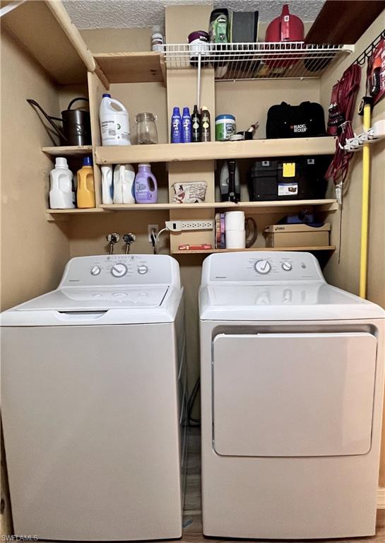 256 Palm Drive, Unit 6 Naples, FL 34112 - Photo 11 of 27 a utility room with washer and dryer