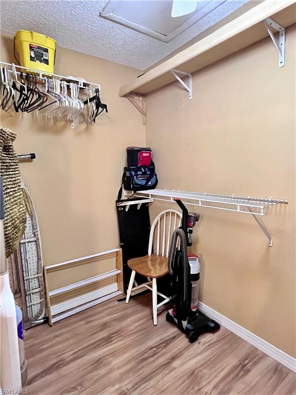 256 Palm Drive, Unit 6 Naples, FL 34112 - Photo 12 of 27 a view of a hallway with wooden floor and windows