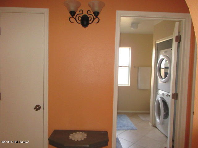 1022 Via Independencia Rio Rico, AZ 85648 - Photo 24 of 41 a view of a bathroom with a washer and dryer