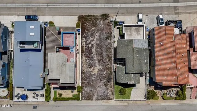 a aerial view of a house with street