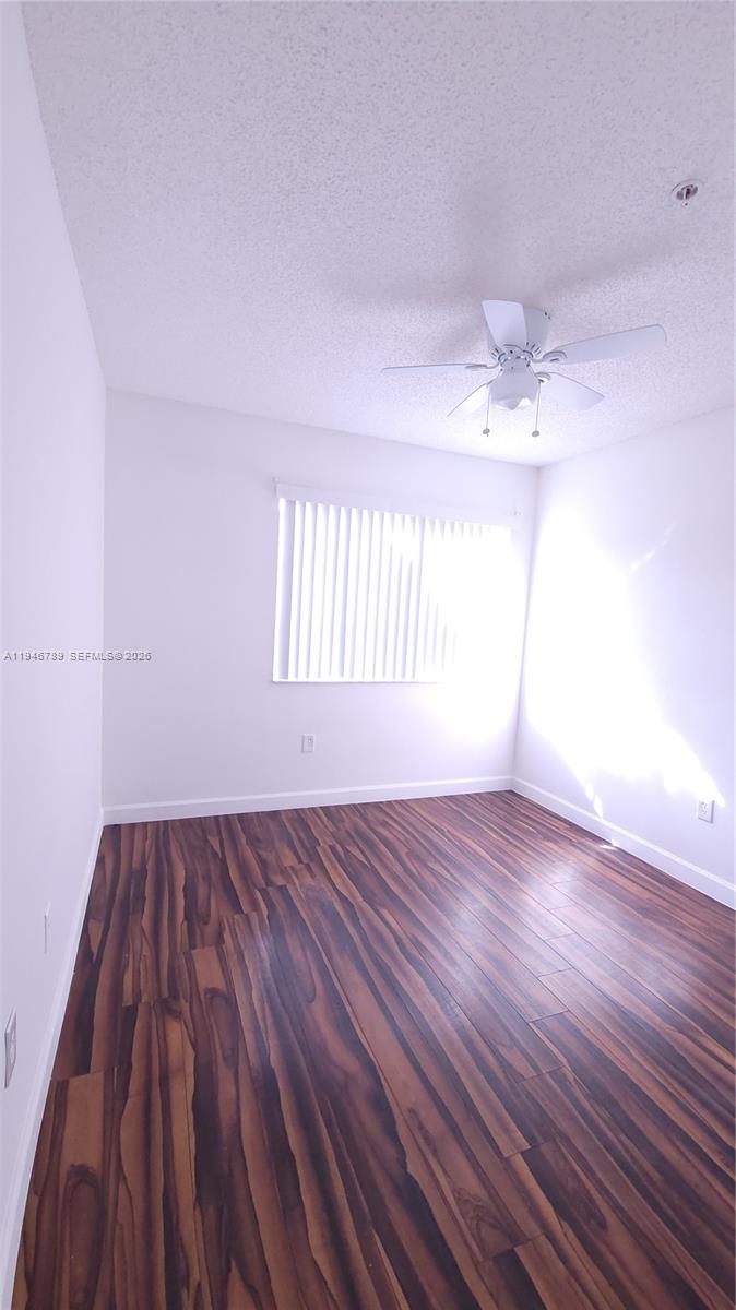2090 West Preserve Way, Unit 301 Miramar, FL 33025 - Photo 13 of 21 wooden floor in an empty room with a window