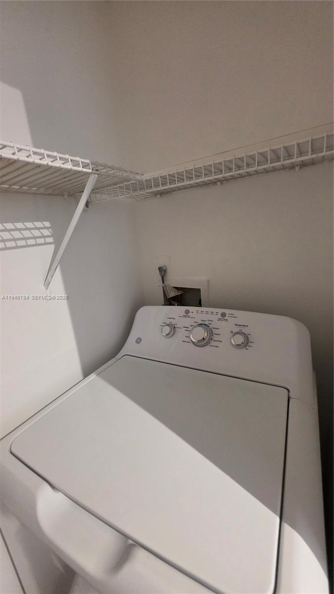 2090 West Preserve Way, Unit 301 Miramar, FL 33025 - Photo 16 of 21 a utility room with dryer and washer