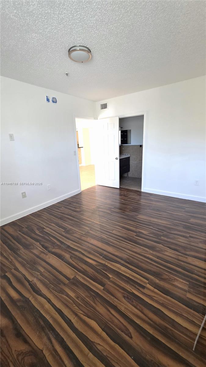 2090 West Preserve Way, Unit 301 Miramar, FL 33025 - Photo 10 of 21 a view of empty room with wooden floor
