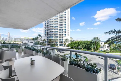 a view of a balcony with chairs