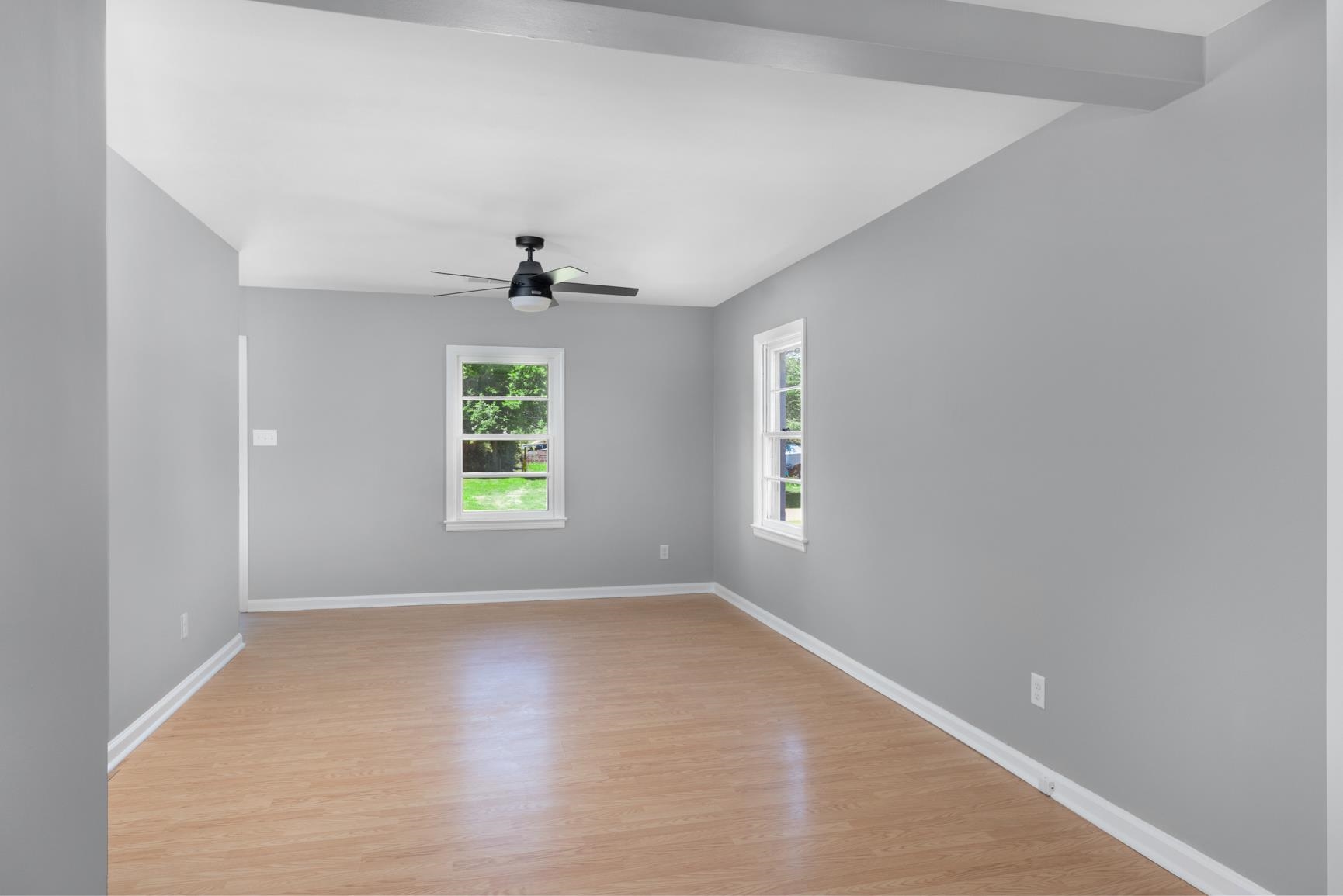 7662 Marvin Road Millington, TN 38053 - Photo 9 of 20 Spacious interior room with wood-finish flooring, light gray wall tones, and white trim