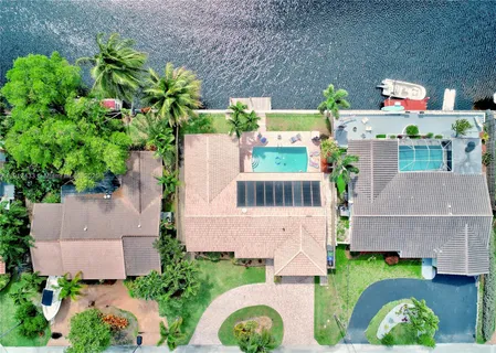 an aerial view of a house with a garden