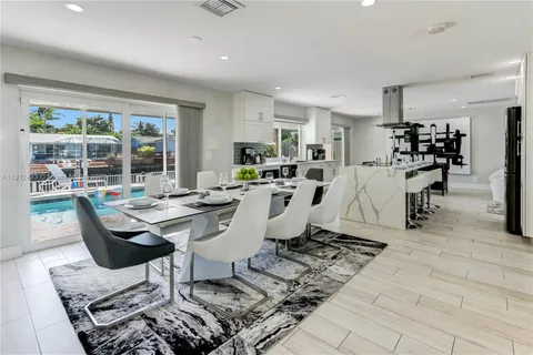 a living room with lots of furniture and a table