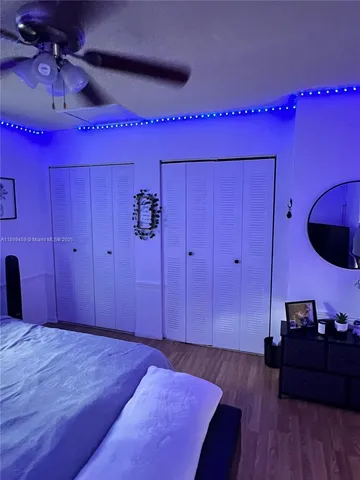 a bedroom with a bed and a mirror