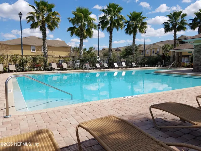 a view of a swimming pool and lake view