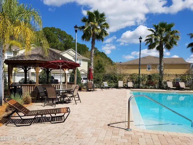 a view of a patio with swimming pool