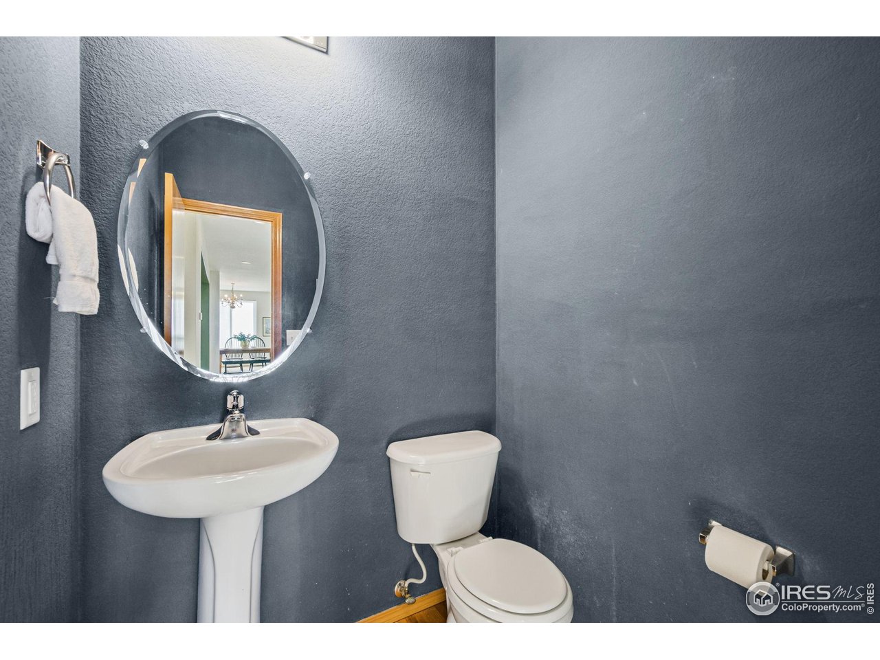 7133 Ranger Drive Fort Collins, CO 80526 - Photo 18 of 33 a bathroom with a toilet sink and mirror