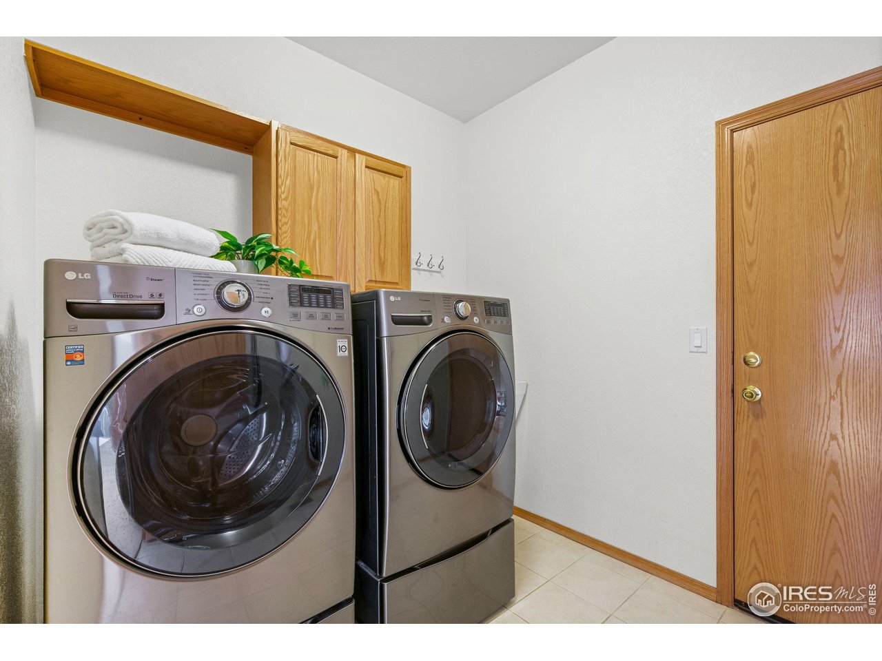 7133 Ranger Drive Fort Collins, CO 80526 - Photo 19 of 33 a utility room with sink dryer and washer
