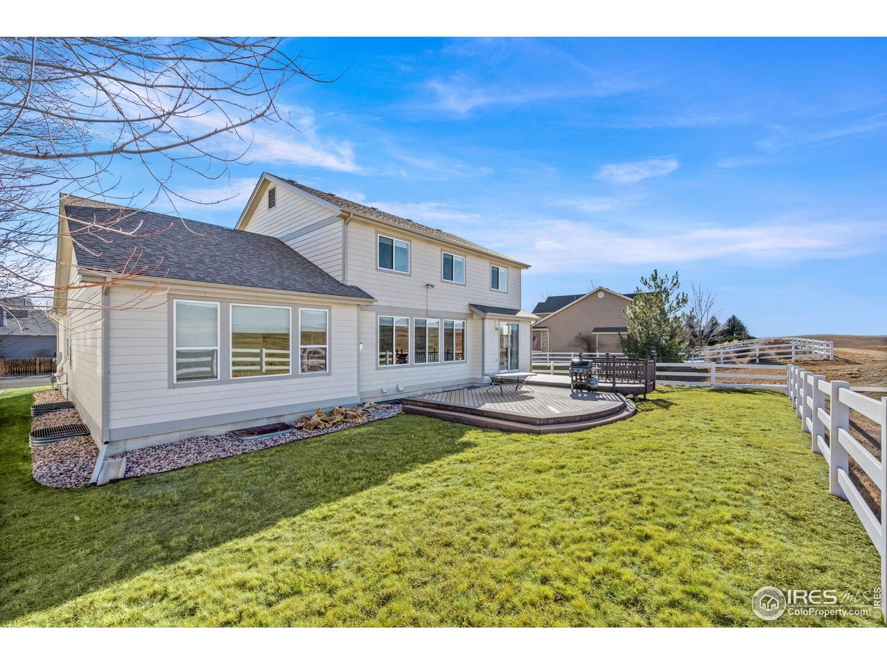 7133 Ranger Drive Fort Collins, CO 80526 - Photo 28 of 33 a view of a house with swimming pool and a yard