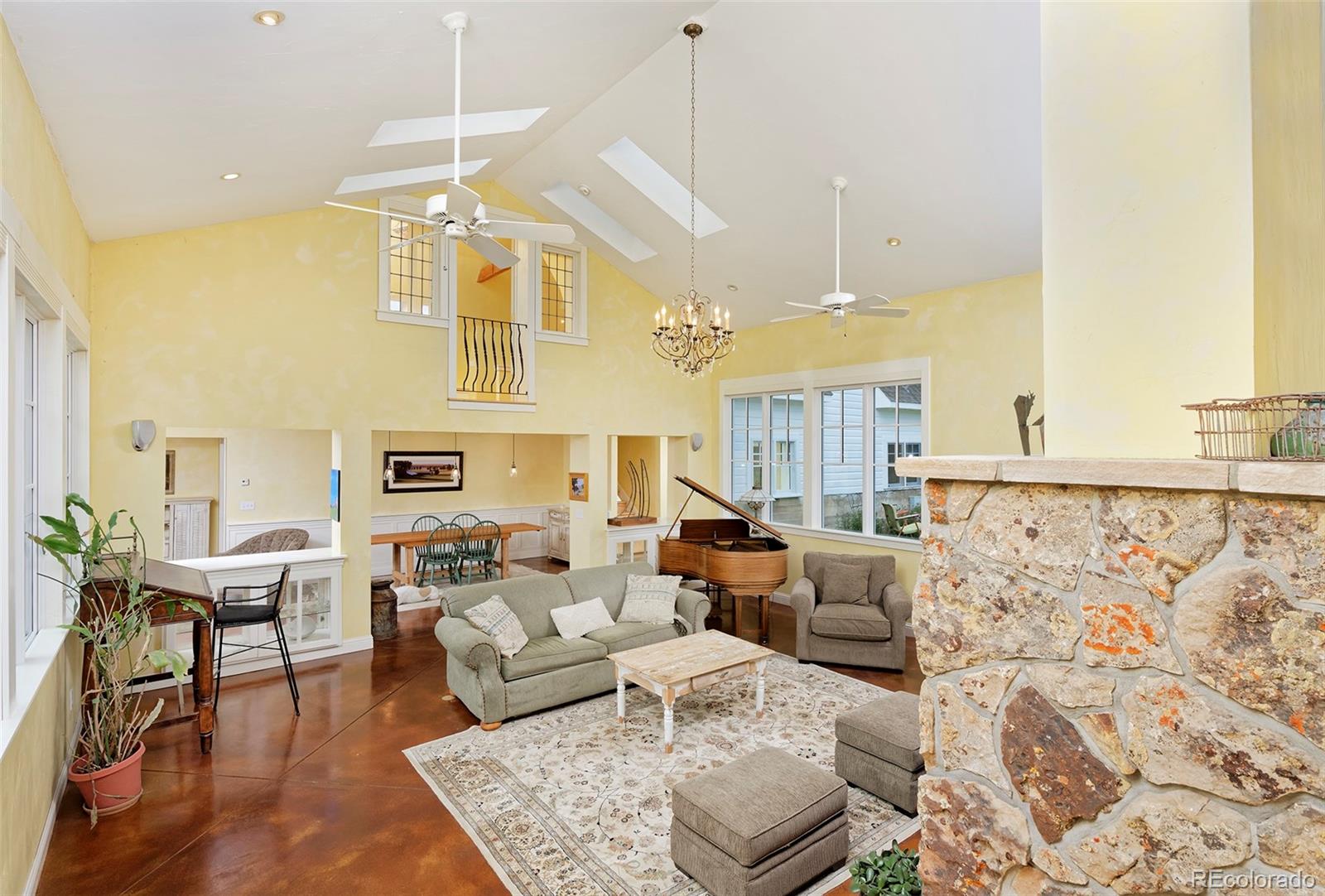 5875 Monarch Road Longmont, CO 80503 - Photo 11 of 38 a living room with furniture and a chandelier