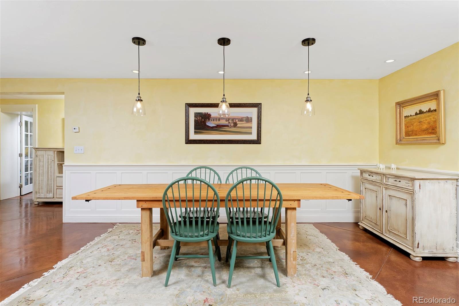 5875 Monarch Road Longmont, CO 80503 - Photo 12 of 38 a view of a dining room with furniture wooden floor and a chandelier