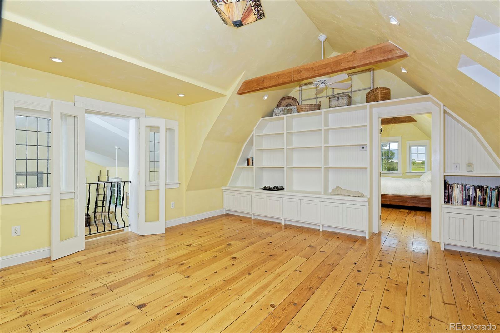5875 Monarch Road Longmont, CO 80503 - Photo 17 of 38 a view of empty room with wooden floor and cabinet
