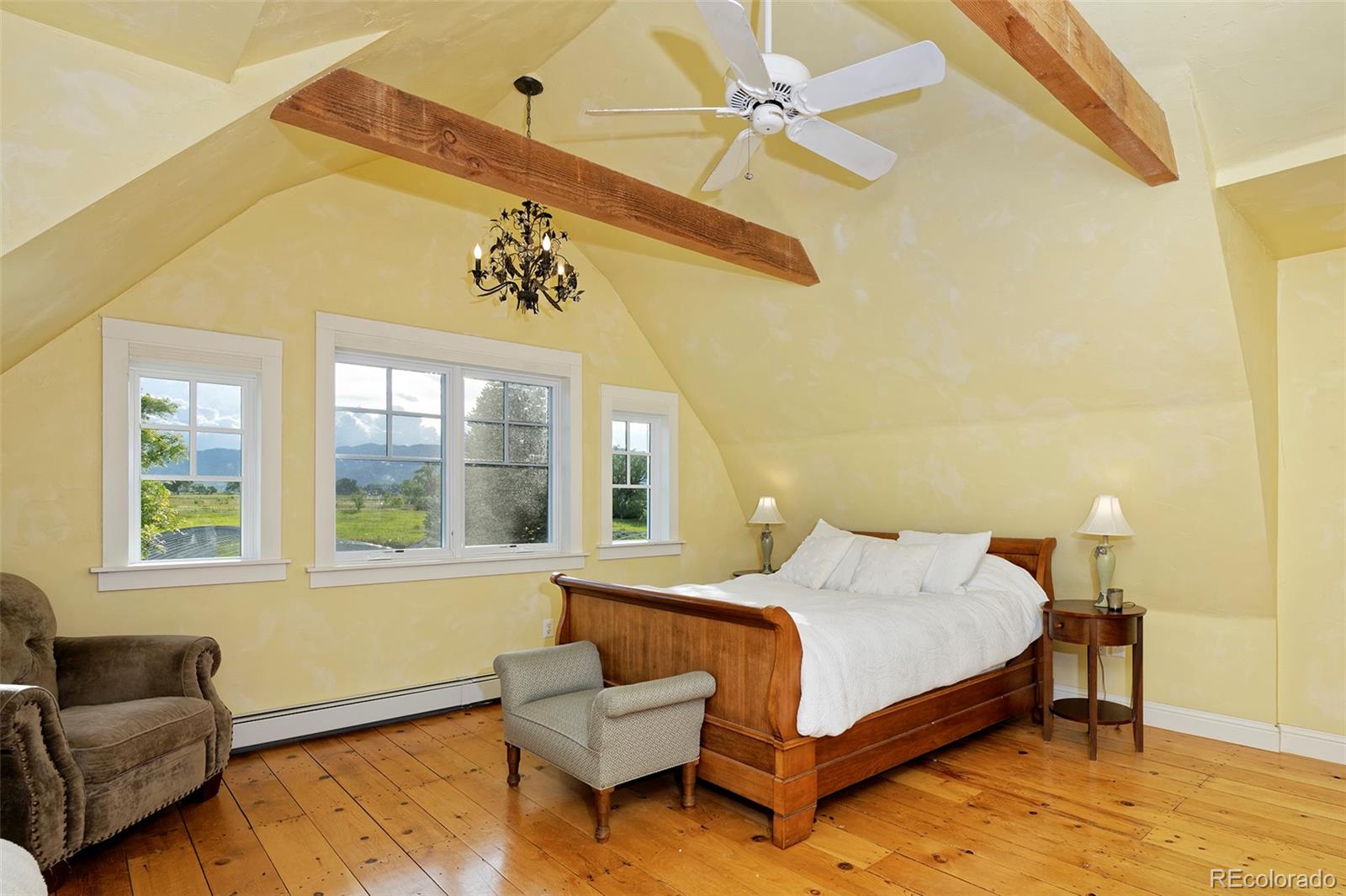 5875 Monarch Road Longmont, CO 80503 - Photo 19 of 38 a bedroom with a bed couch and a window